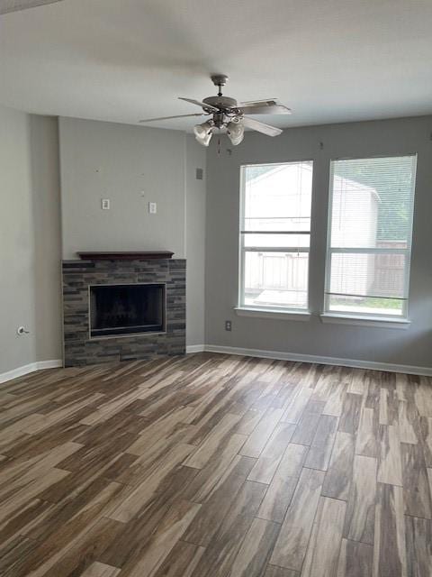 12326 Garden Gale Ln, Houston, TX 77044 - unfurnished living room featuring wood finished floors, a fireplace, and a ceiling fan