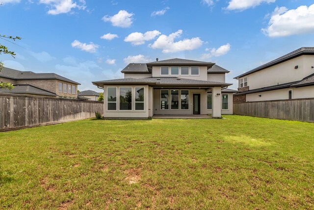 15643 Thirsty Horse Trl, Cypress, TX 77433 - back of property featuring a fenced backyard and roof with shingles