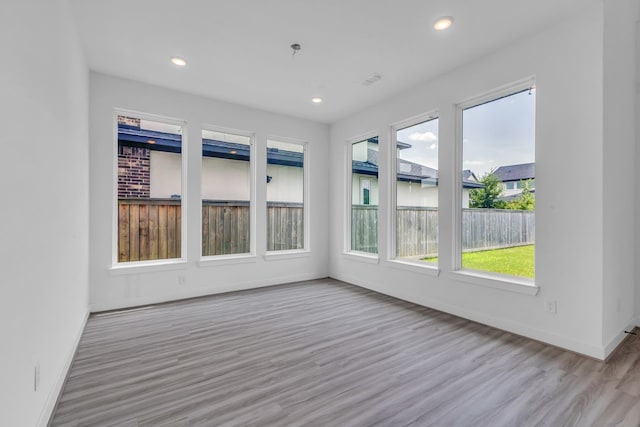 15643 Thirsty Horse Trl, Cypress, TX 77433 - unfurnished sunroom with wood finished floors and recessed lighting