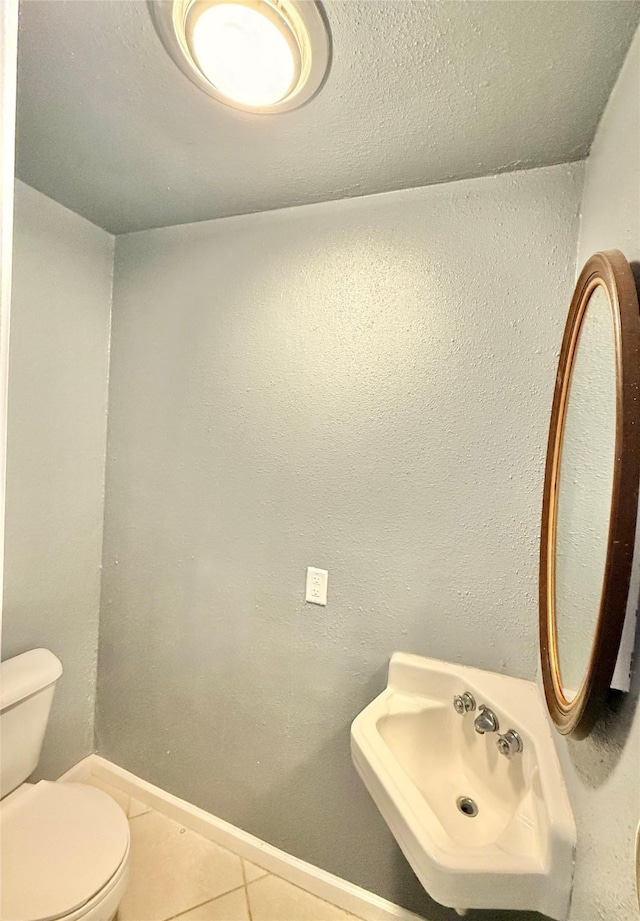 5915 Fairmeadow Dr, Beaumont, TX 77707 - bathroom featuring tile patterned floors and toilet