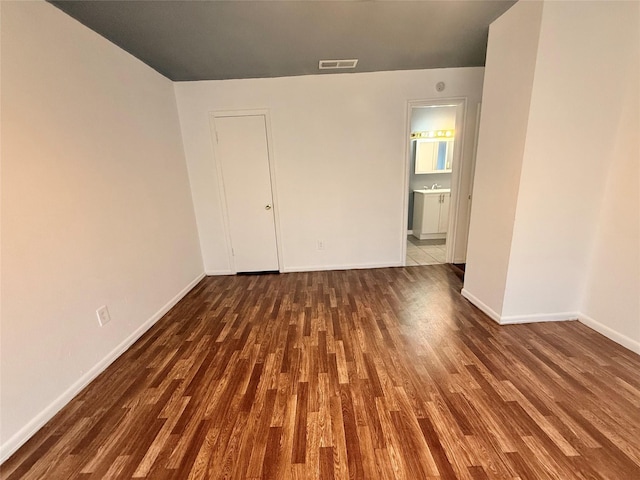 5915 Fairmeadow Dr, Beaumont, TX 77707 - unfurnished room with dark wood-style flooring