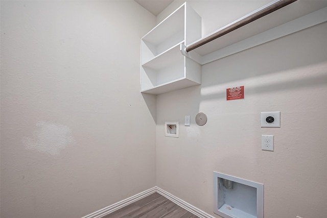 1111 Teamriddle Way, Richmond, TX 77406 - washroom with hookup for a gas dryer, electric dryer hookup, dark wood-style floors, and hookup for a washing machine