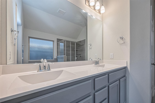1111 Teamriddle Way, Richmond, TX 77406 - bathroom with double vanity, a shower stall, and vaulted ceiling