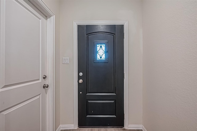 1111 Teamriddle Way, Richmond, TX 77406 - entryway with baseboards and wood finished floors