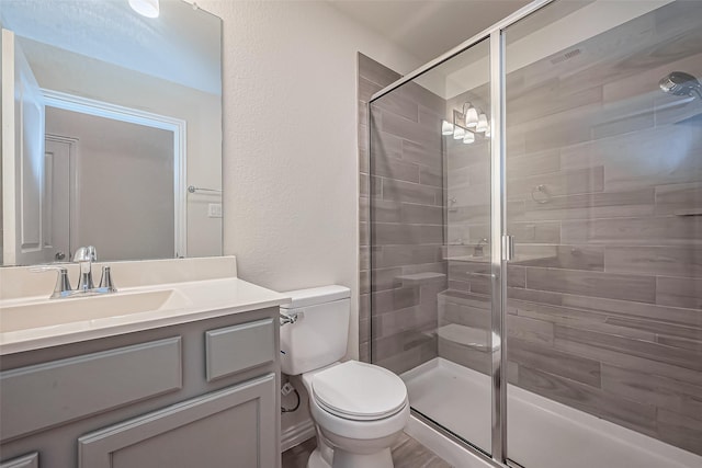 1111 Teamriddle Way, Richmond, TX 77406 - full bathroom with a stall shower, vanity, and a textured wall