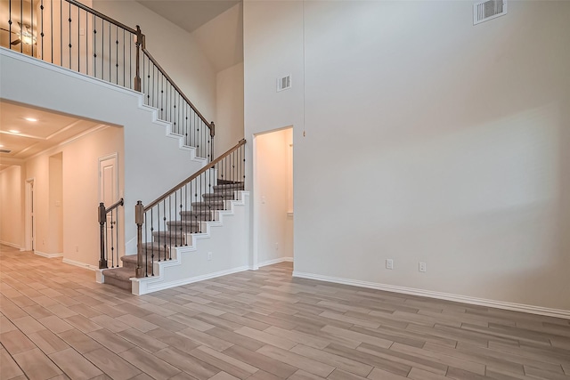 1111 Teamriddle Way, Richmond, TX 77406 - stairway featuring wood finish floors and a towering ceiling