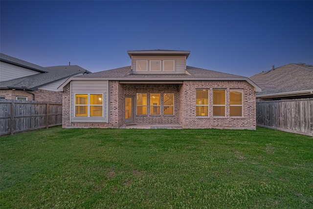 1111 Teamriddle Way, Richmond, TX 77406 - rear view of property with brick siding, a fenced backyard, a patio area, and roof with shingles