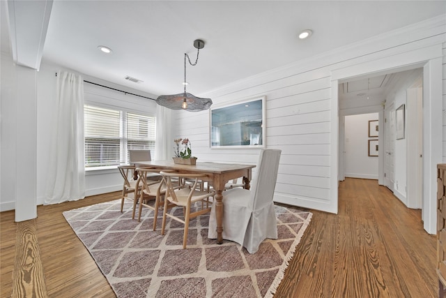 604 E 10th 1/2 St, Houston, TX 77008 - dining space featuring attic access, wood finished floors, recessed lighting, and wood walls