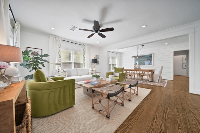 604 E 10th 1/2 St, Houston, TX 77008 - living room with wood finished floors, ceiling fan, ornamental molding, and recessed lighting