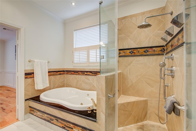 4400 Edith St, Bellaire, TX 77401 - bathroom featuring a stall shower, a whirlpool tub, ornamental molding, and a wainscoted wall