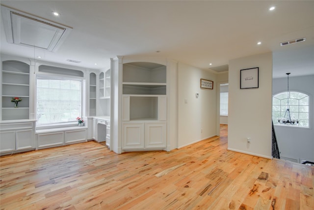 4400 Edith St, Bellaire, TX 77401 - empty room with attic access, light wood finished floors, and recessed lighting