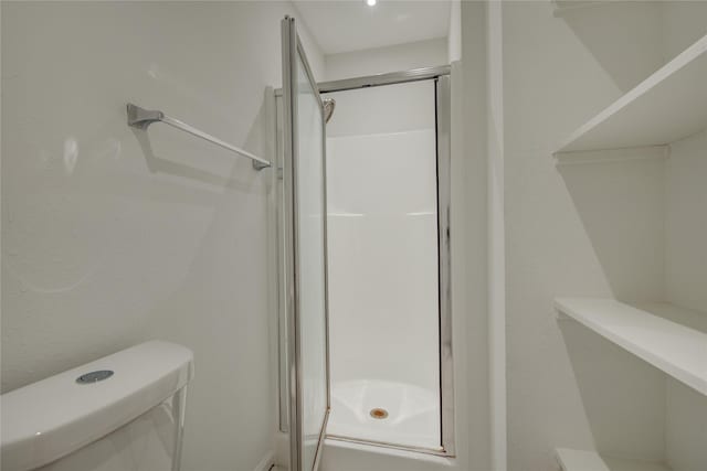4400 Edith St, Bellaire, TX 77401 - bathroom featuring a shower stall and toilet