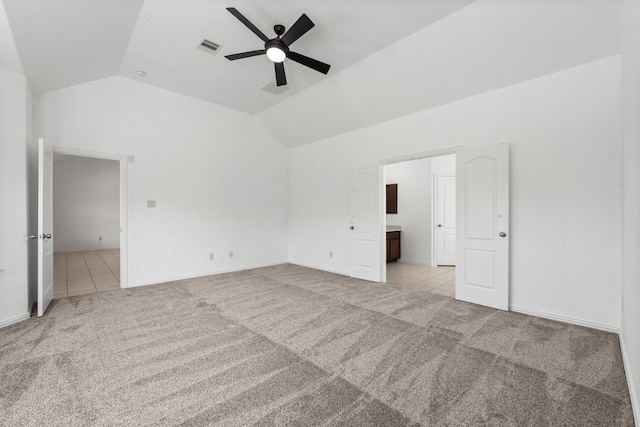 22303 Mosshall Ct, Tomball, TX 77375 - spare room featuring light carpet, lofted ceiling, ceiling fan, and light tile patterned flooring
