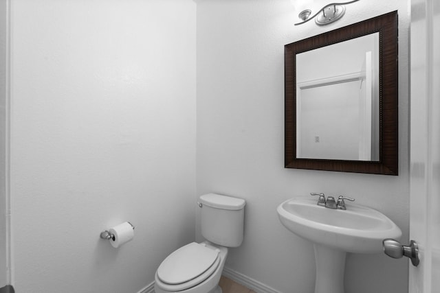 22303 Mosshall Ct, Tomball, TX 77375 - half bath with toilet and baseboards
