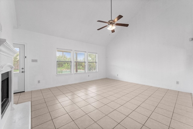 22303 Mosshall Ct, Tomball, TX 77375 - unfurnished living room with high vaulted ceiling, a fireplace, ceiling fan, and light tile patterned flooring