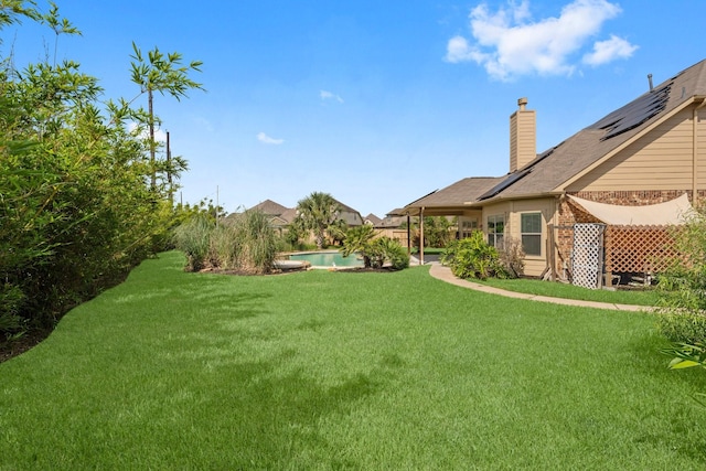 22303 Mosshall Ct, Tomball, TX 77375 - view of grassy yard with an outdoor pool