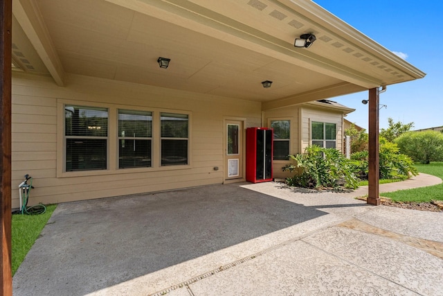 22303 Mosshall Ct, Tomball, TX 77375 - property entrance with a patio area and an attached carport