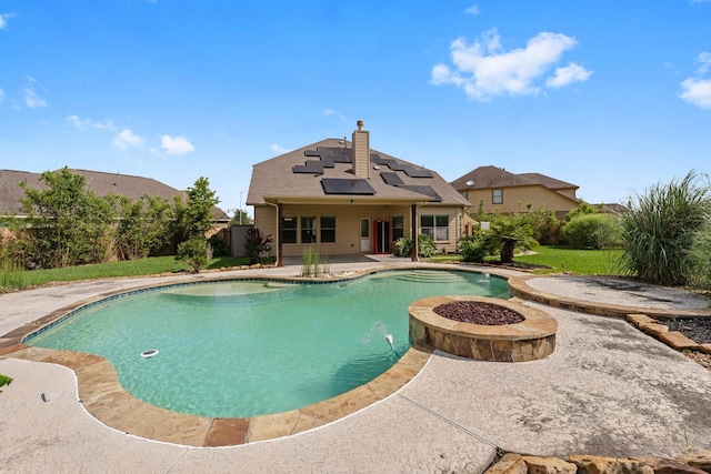 22303 Mosshall Ct, Tomball, TX 77375 - view of swimming pool with a patio area, a pool with connected hot tub, a fenced backyard, and an outdoor fire pit