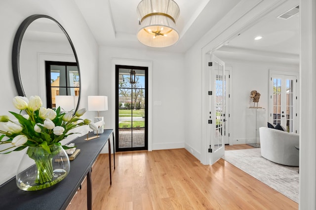 4902 Oak Forest Dr, Houston, TX 77018 - entrance foyer featuring a tray ceiling, light wood-style flooring, and recessed lighting