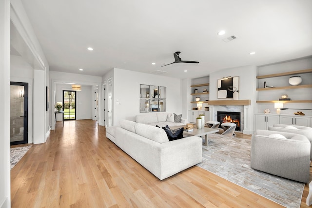 4902 Oak Forest Dr, Houston, TX 77018 - living area with a premium fireplace, light wood finished floors, ceiling fan, and recessed lighting