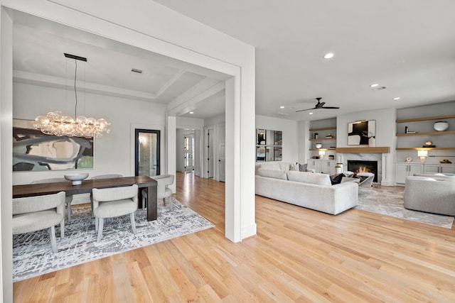 4902 Oak Forest Dr, Houston, TX 77018 - dining space with wood finished floors, a ceiling fan, recessed lighting, a high end fireplace, and a chandelier
