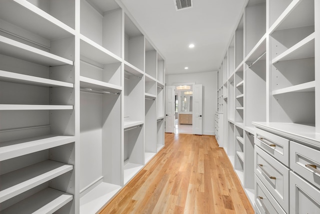 4902 Oak Forest Dr, Houston, TX 77018 - walk in closet with light wood-style floors