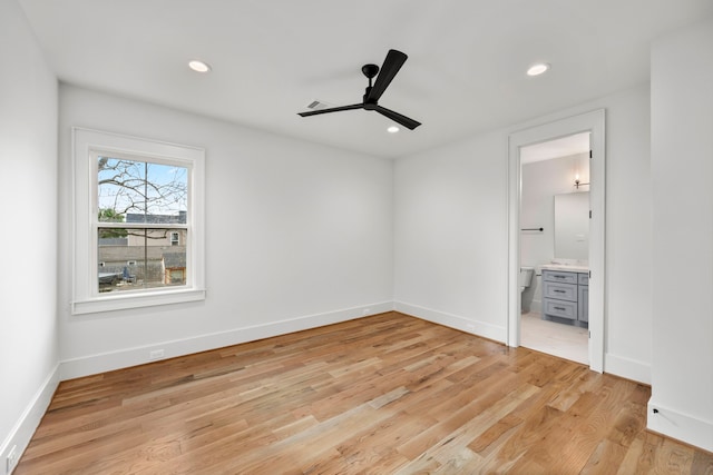 4902 Oak Forest Dr, Houston, TX 77018 - unfurnished bedroom with light wood-type flooring, recessed lighting, connected bathroom, and a ceiling fan