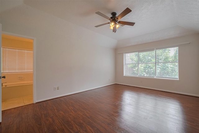 21319 Park Mill Dr, Katy, TX 77450 - empty room featuring a ceiling fan, wood finished floors, and vaulted ceiling