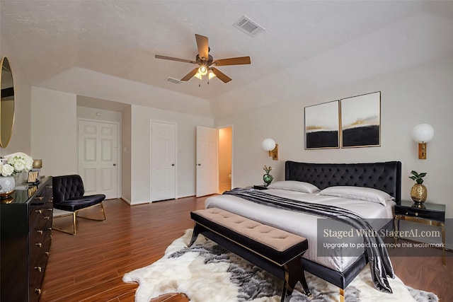 21319 Park Mill Dr, Katy, TX 77450 - bedroom with wood finished floors, a raised ceiling, and a ceiling fan