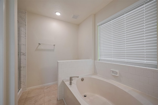 21319 Park Mill Dr, Katy, TX 77450 - bathroom with a bath, tile patterned floors, and a shower
