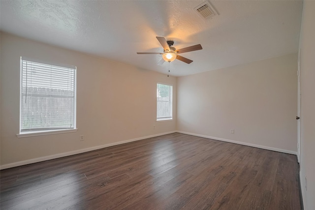 21319 Park Mill Dr, Katy, TX 77450 - empty room with dark wood-style flooring and a ceiling fan