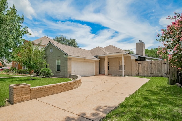 21319 Park Mill Dr, Katy, TX 77450 - single story home featuring an attached garage, driveway, brick siding, and a chimney