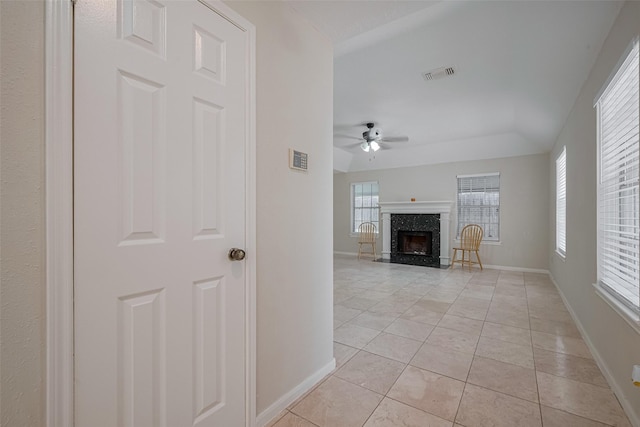 21319 Park Mill Dr, Katy, TX 77450 - unfurnished living room featuring a ceiling fan, light tile patterned floors, and a fireplace