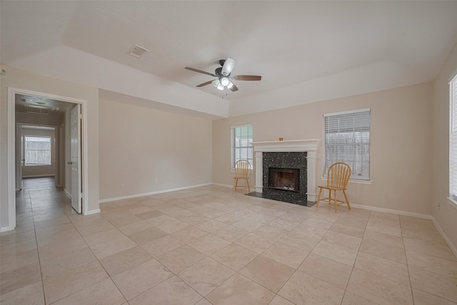 21319 Park Mill Dr, Katy, TX 77450 - unfurnished living room featuring light tile patterned floors, a ceiling fan, and healthy amount of natural light