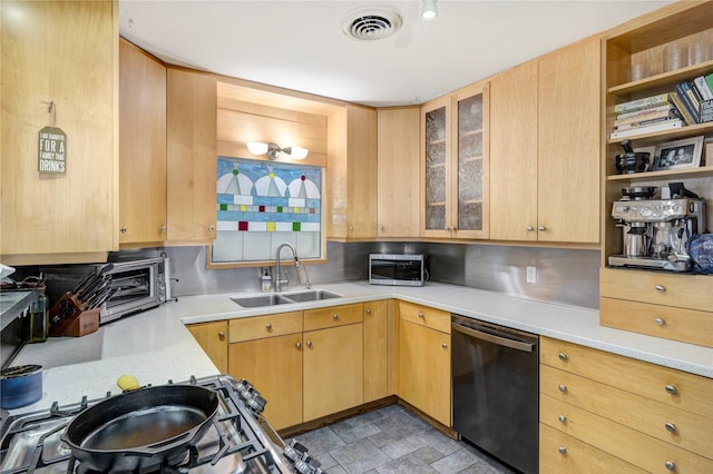 1522 Glen Oaks St, Houston, TX 77008 - kitchen featuring dishwasher, stainless steel microwave, light countertops, glass insert cabinets, and light brown cabinets