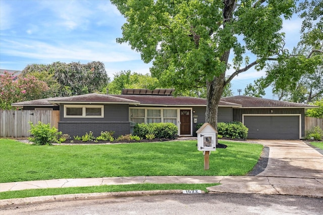 1522 Glen Oaks St, Houston, TX 77008 - ranch-style house with a garage, brick siding, and driveway