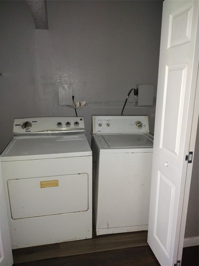 1108 Niagara St, Houston, TX 77051 - washroom featuring washing machine and dryer and dark wood finished floors