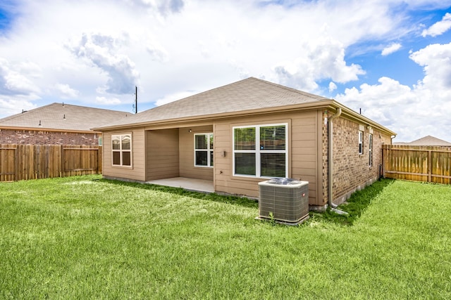 444 Maple Fawn Dr, Katy, TX 77493 - back of property with a fenced backyard, a patio, brick siding, and a shingled roof