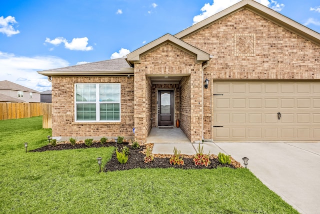 444 Maple Fawn Dr, Katy, TX 77493 - view of front of home featuring brick siding, concrete driveway, a garage, and a shingled roof