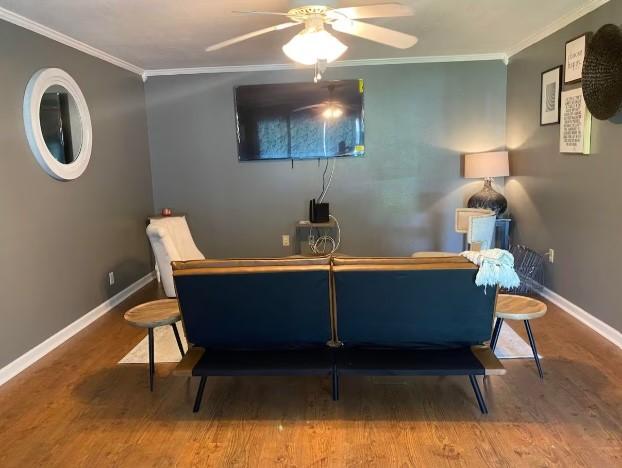 160 E Darby St, Bridge City, TX 77611 - sitting room with wood finished floors, ornamental molding, and ceiling fan