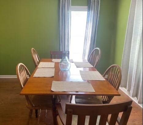 160 E Darby St, Bridge City, TX 77611 - dining room with plenty of natural light and wood finished floors