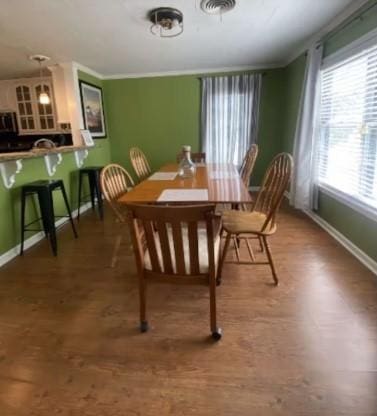 160 E Darby St, Bridge City, TX 77611 - dining room featuring baseboards and wood finished floors