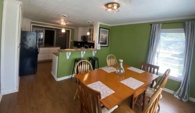 160 E Darby St, Bridge City, TX 77611 - dining space with dark wood finished floors and baseboards