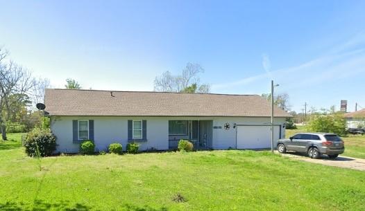 160 E Darby St, Bridge City, TX 77611 - ranch-style house featuring driveway, a garage, and a front lawn