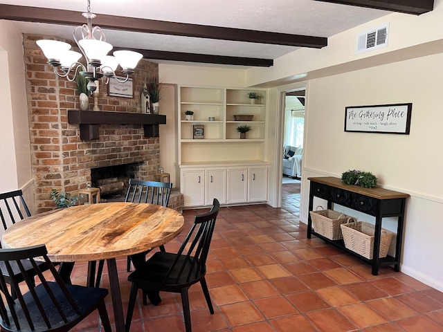 33410 Cripple Creek Dr, Pinehurst, TX 77362 - tiled dining space featuring beamed ceiling, a chandelier, and a brick fireplace