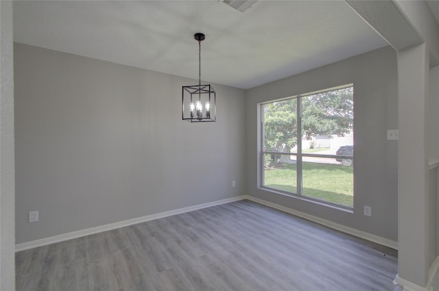 11623 Silent Elm St, Houston, TX 77044 - spare room featuring wood finished floors and a chandelier