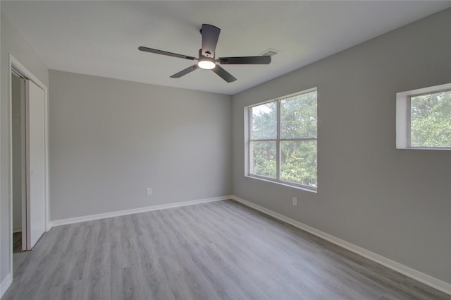 11623 Silent Elm St, Houston, TX 77044 - empty room with wood finished floors and a ceiling fan