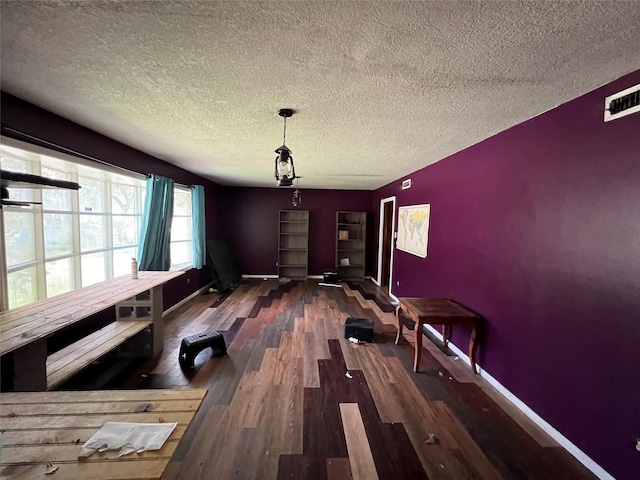 3709 Kettering Ave, Bay City, TX 77414 - unfurnished dining area featuring a textured ceiling and wood finished floors