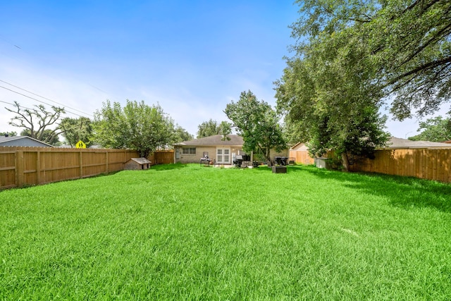 4002 Ebbtide Drive St, Houston, TX 77045 - fenced backyard featuring a storage shed