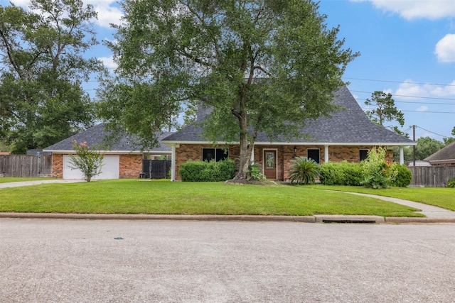 24418 Okehampton Dr, Tomball, TX 77375 - view of front of property featuring driveway, brick siding, a garage, and a shingled roof